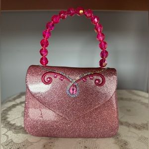 Pink sparkly patent leather purse with beaded handle